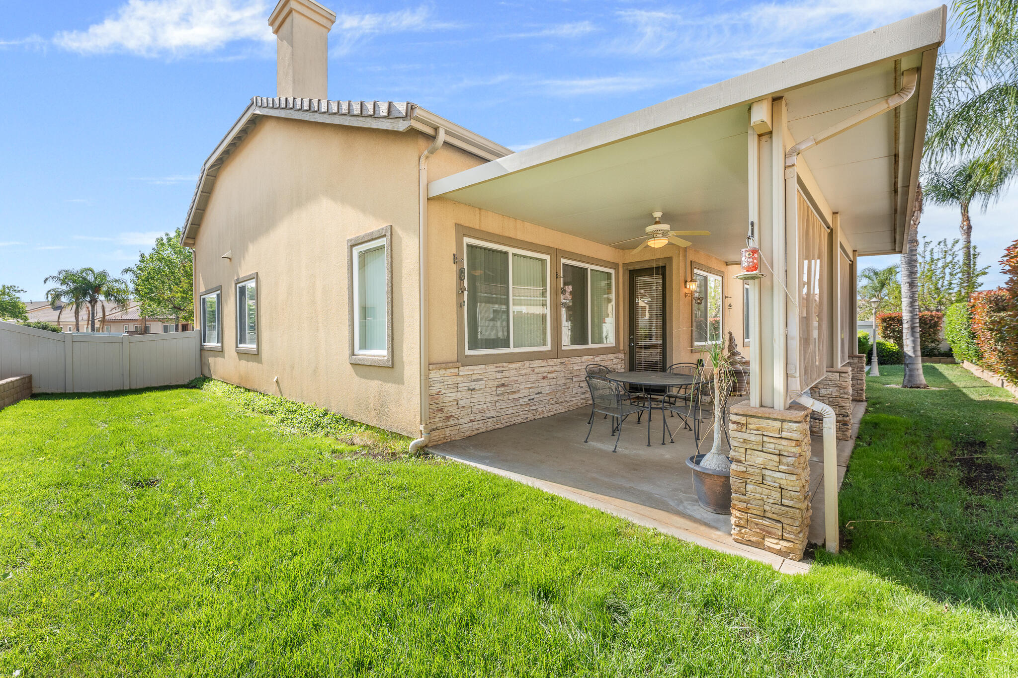 744 Copper Circle Beaumont, CA 92223 - Photo 34 of 44 a front view of a house with a garden and patio
