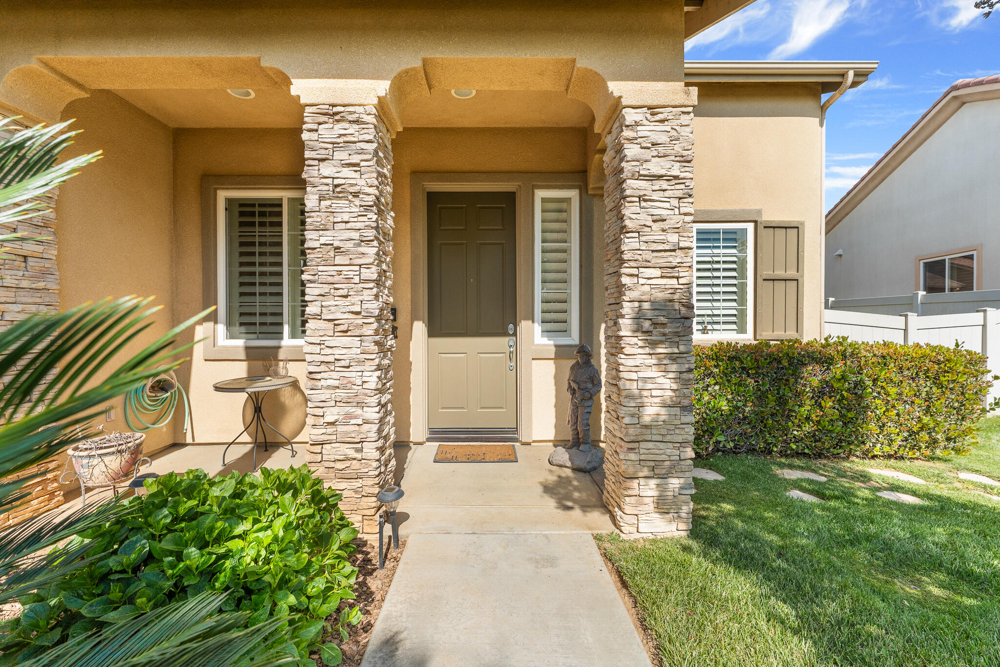 744 Copper Circle Beaumont, CA 92223 - Photo 6 of 44 a front view of a house with a yard