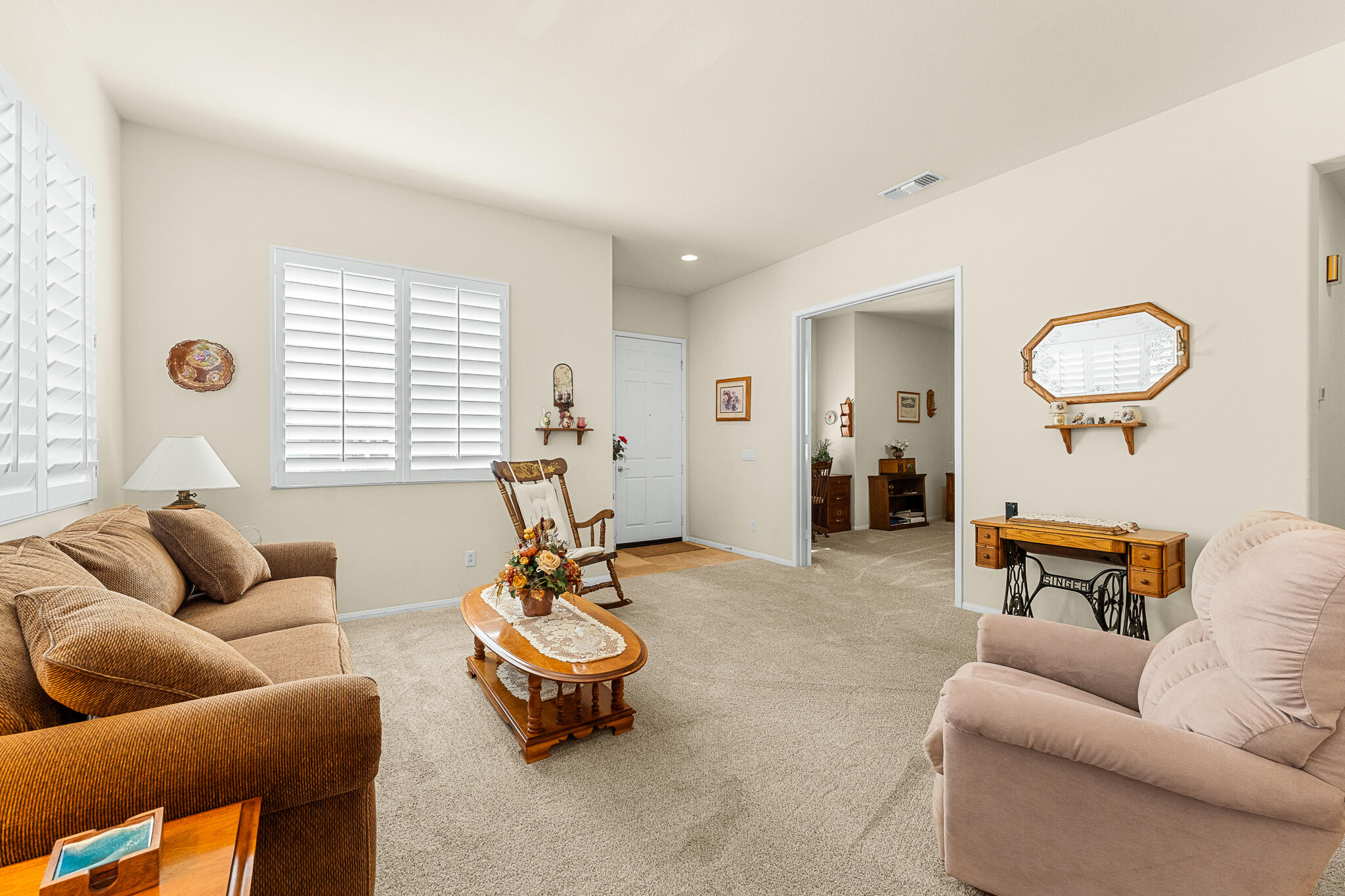744 Copper Circle Beaumont, CA 92223 - Photo 9 of 44 a living room with furniture a rug and a window