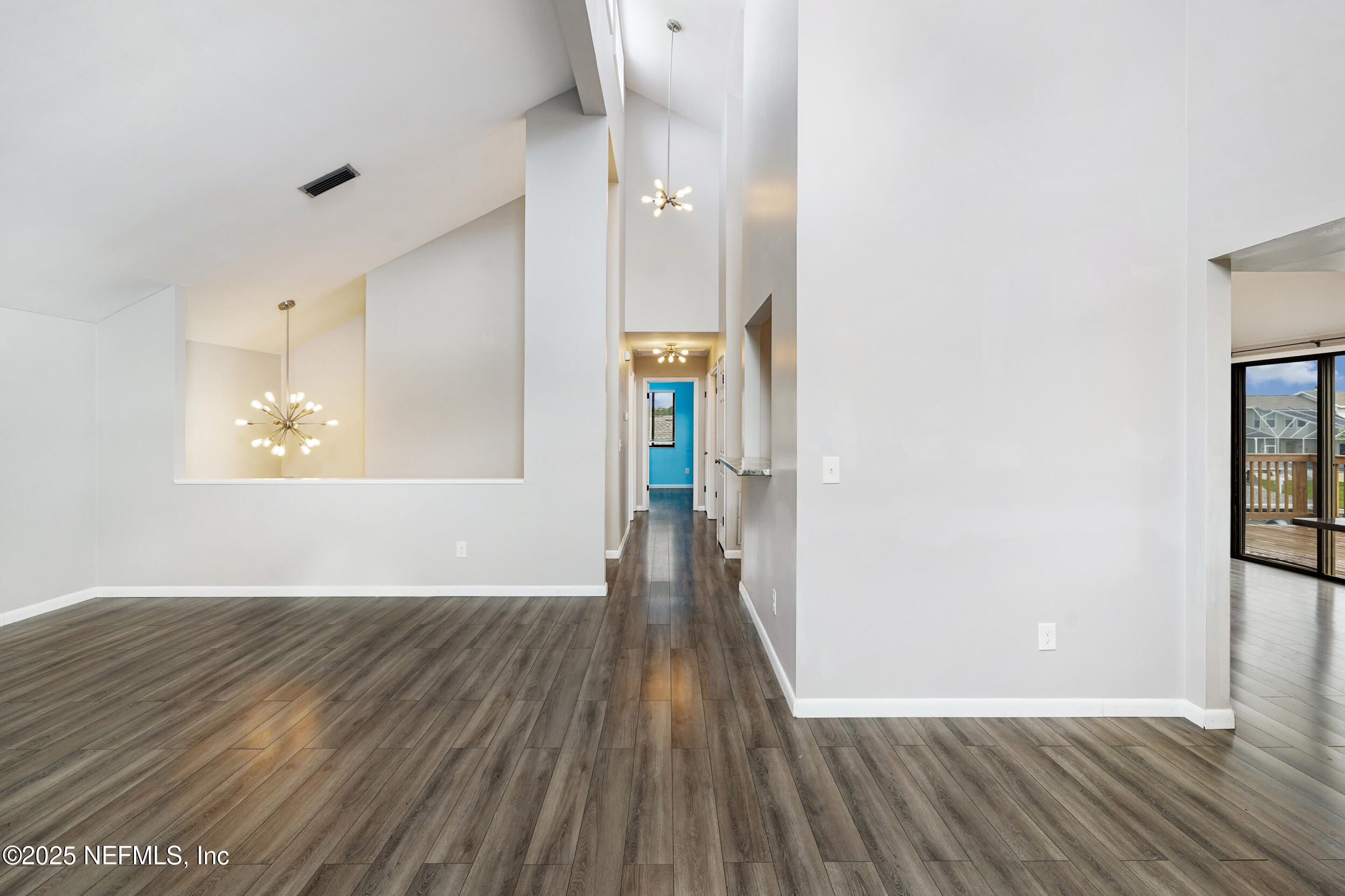 17 Clinton Court South Palm Coast, FL 32137 - Photo 16 of 44 a view of an empty room with wooden floor and a window