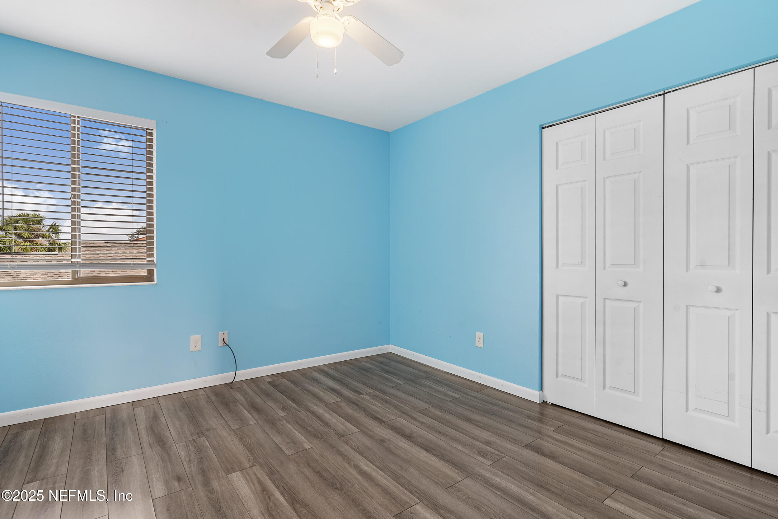 17 Clinton Court South Palm Coast, FL 32137 - Photo 20 of 44 an empty room with wooden floor and windows