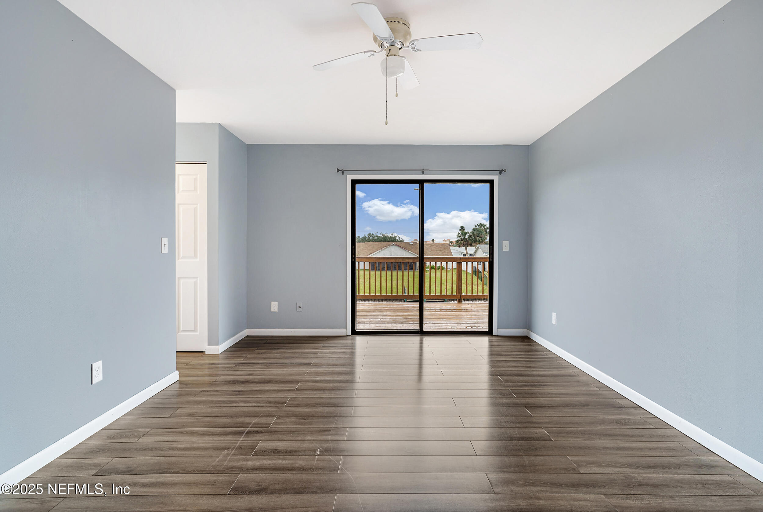 17 Clinton Court South Palm Coast, FL 32137 - Photo 22 of 44 wooden floor in an empty room with a window