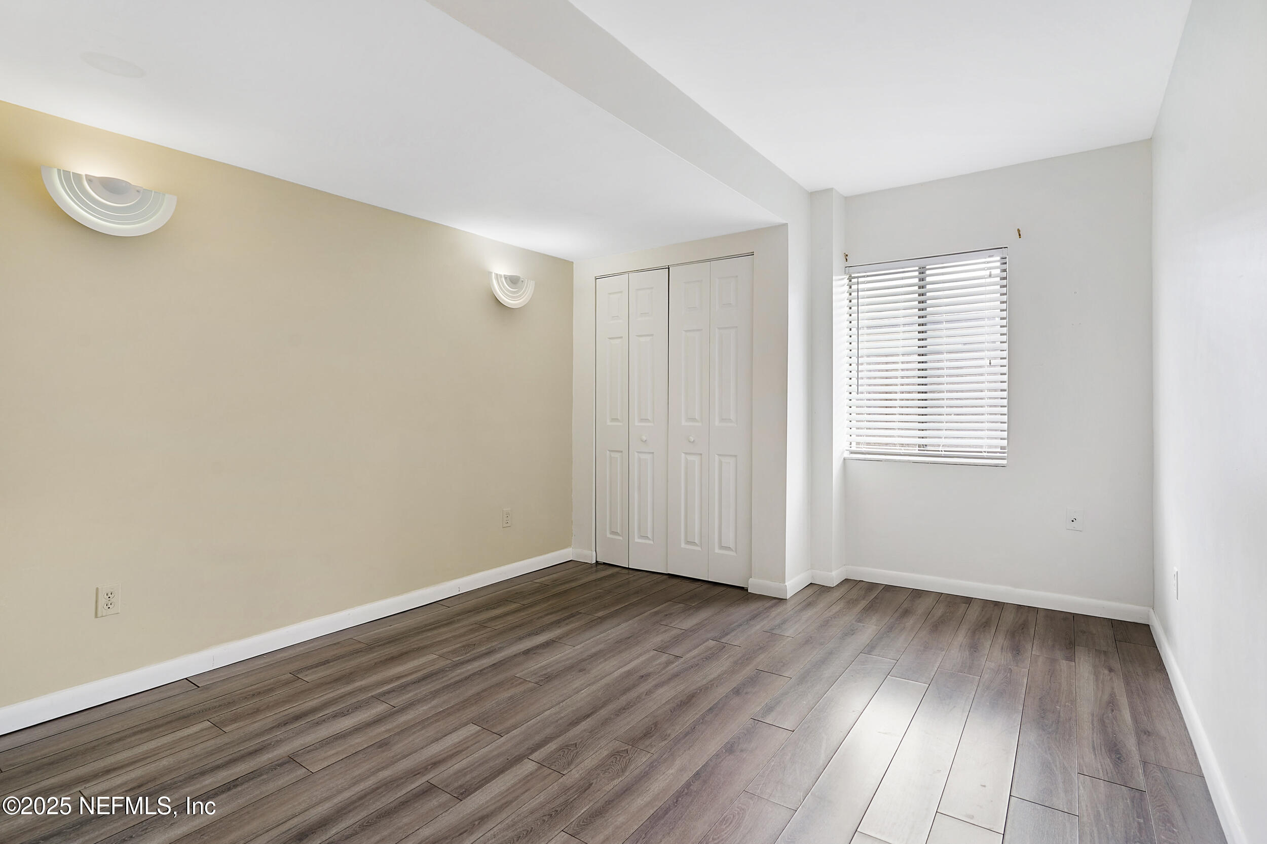 17 Clinton Court South Palm Coast, FL 32137 - Photo 31 of 44 an empty room with wooden floor and windows