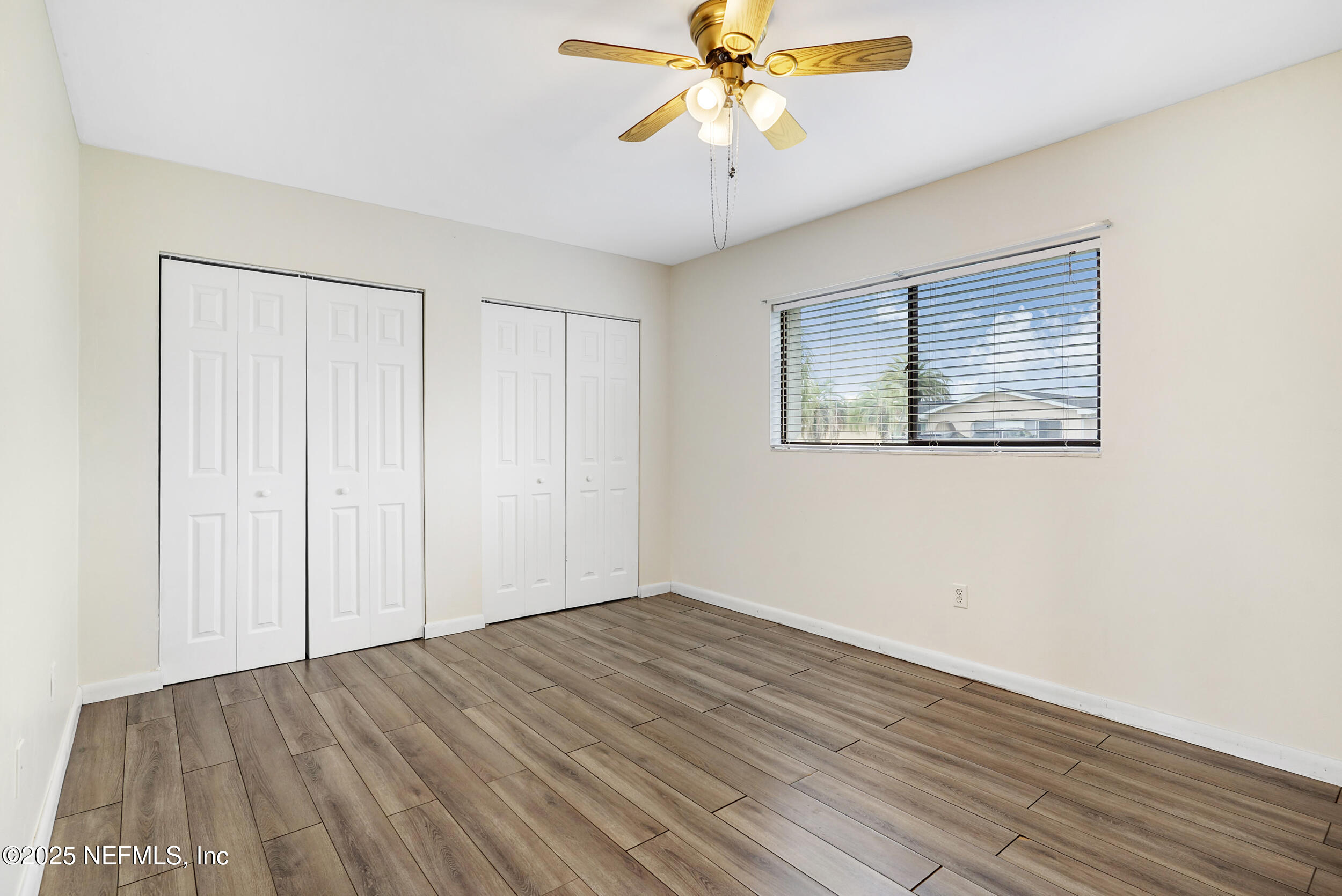 17 Clinton Court South Palm Coast, FL 32137 - Photo 33 of 44 wooden floor in an empty room with a window