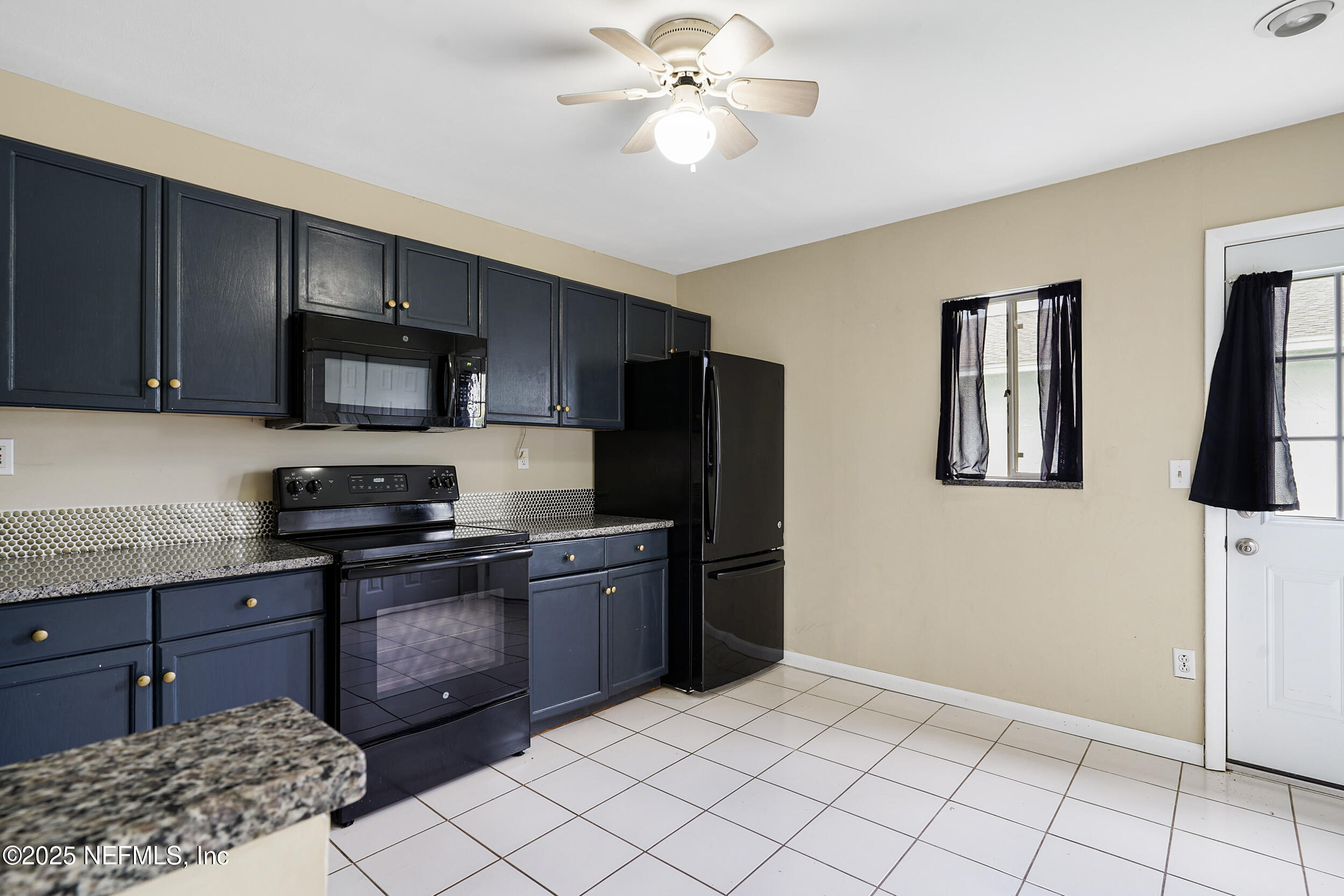17 Clinton Court South Palm Coast, FL 32137 - Photo 36 of 44 a kitchen with stainless steel appliances granite countertop a refrigerator and a stove top oven