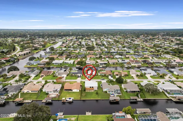 an aerial view of residential building and parking space