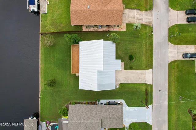 an aerial view of a house with a garden
