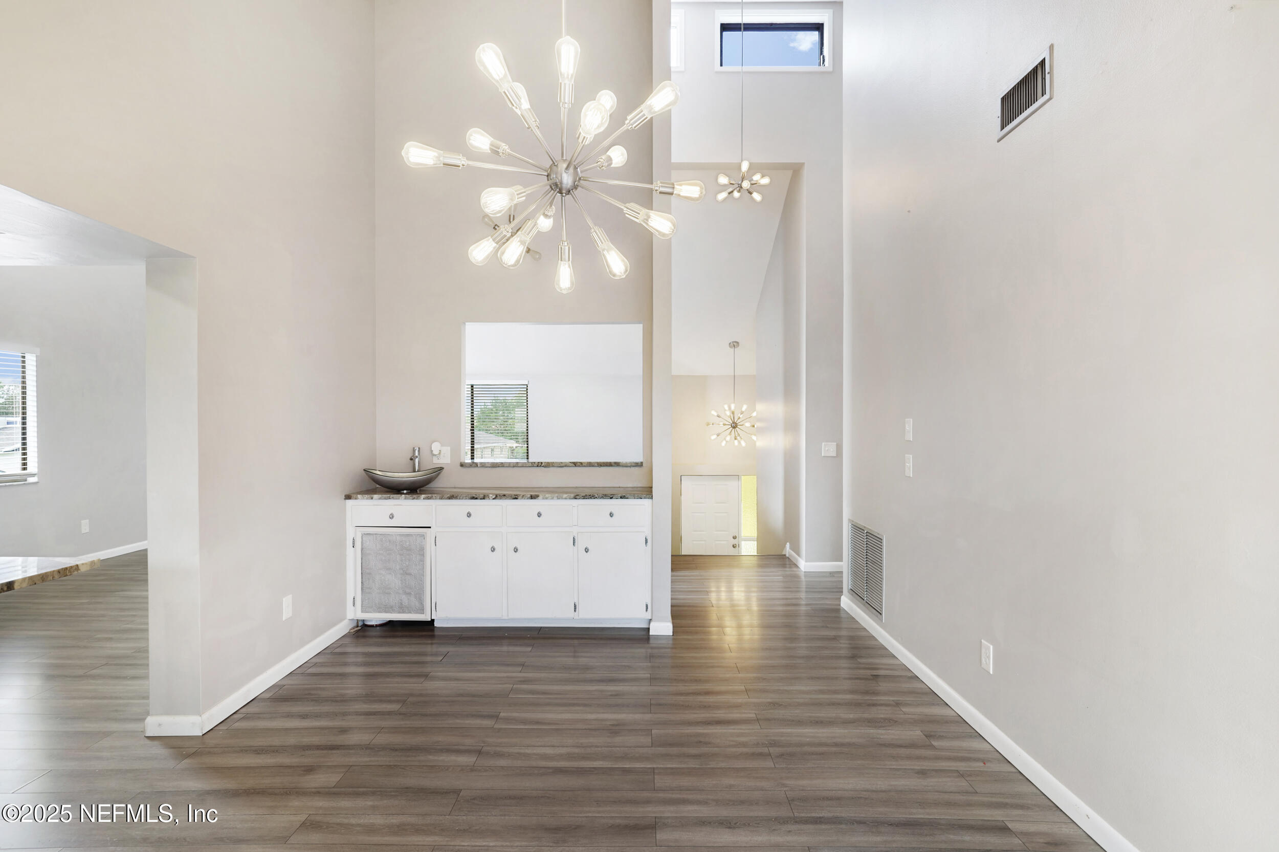 17 Clinton Court South Palm Coast, FL 32137 - Photo 7 of 44 a view of a kitchen with a sink and wooden floor