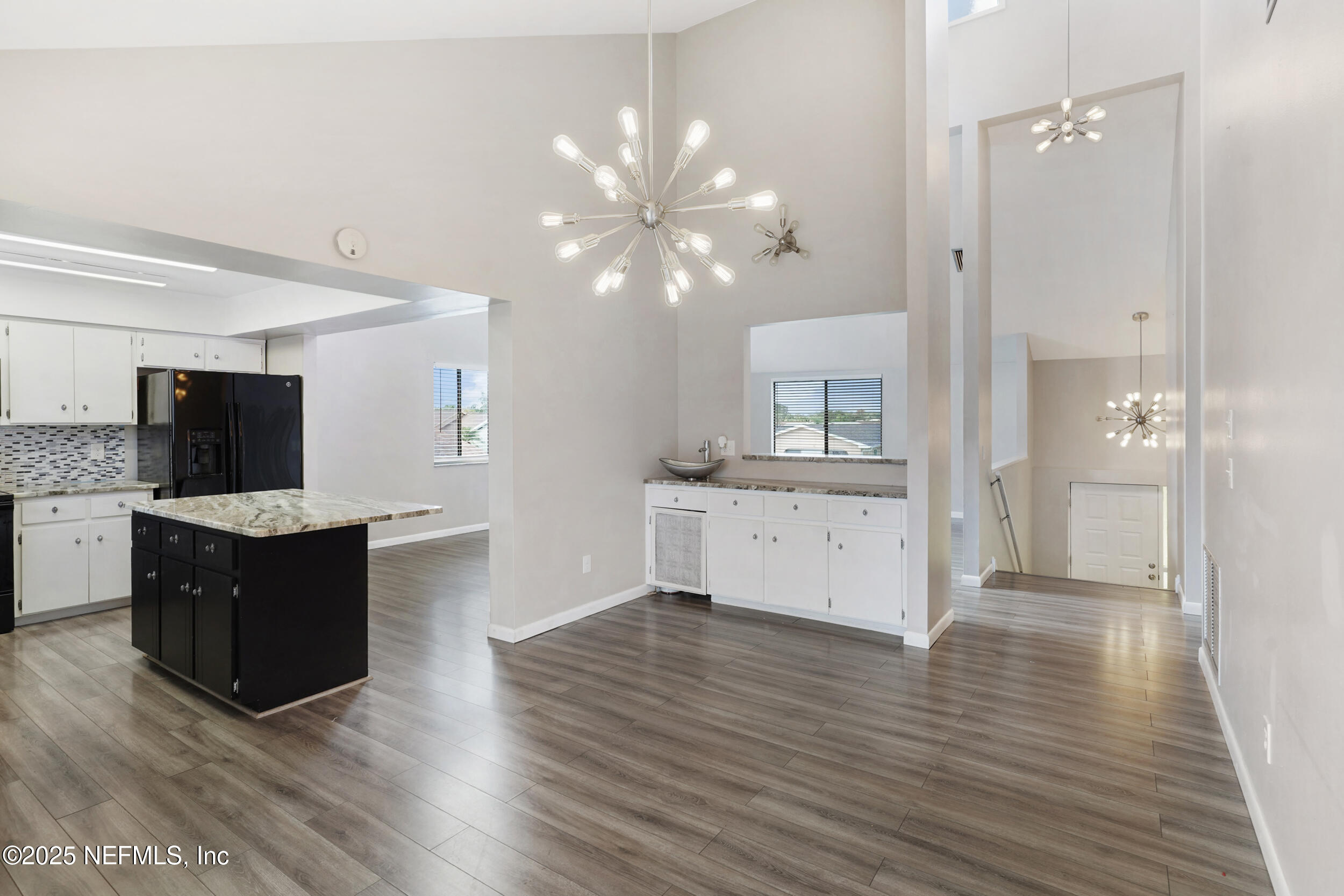 17 Clinton Court South Palm Coast, FL 32137 - Photo 8 of 44 a view of kitchen with granite countertop cabinets and refrigerator