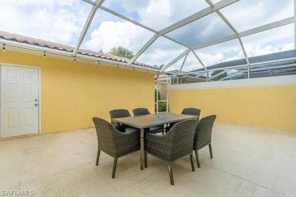 a dining room with furniture and a window