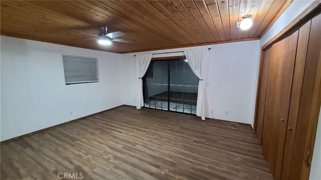 a view of hallway with wooden floor