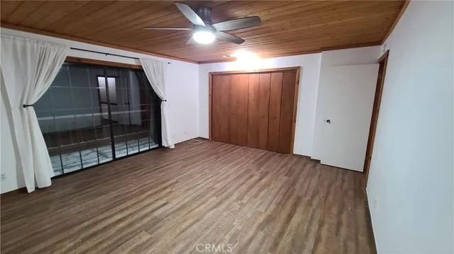 a view of hallway with wooden floor