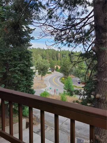 a view of a town with large trees