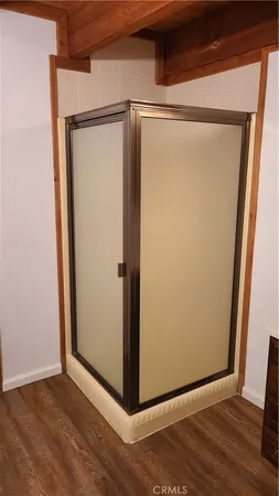 a view of a small space with wooden floor