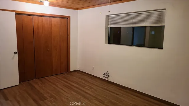 a view of wooden floor and cabinet