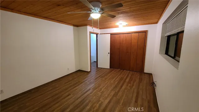 a view of an empty room with a fireplace