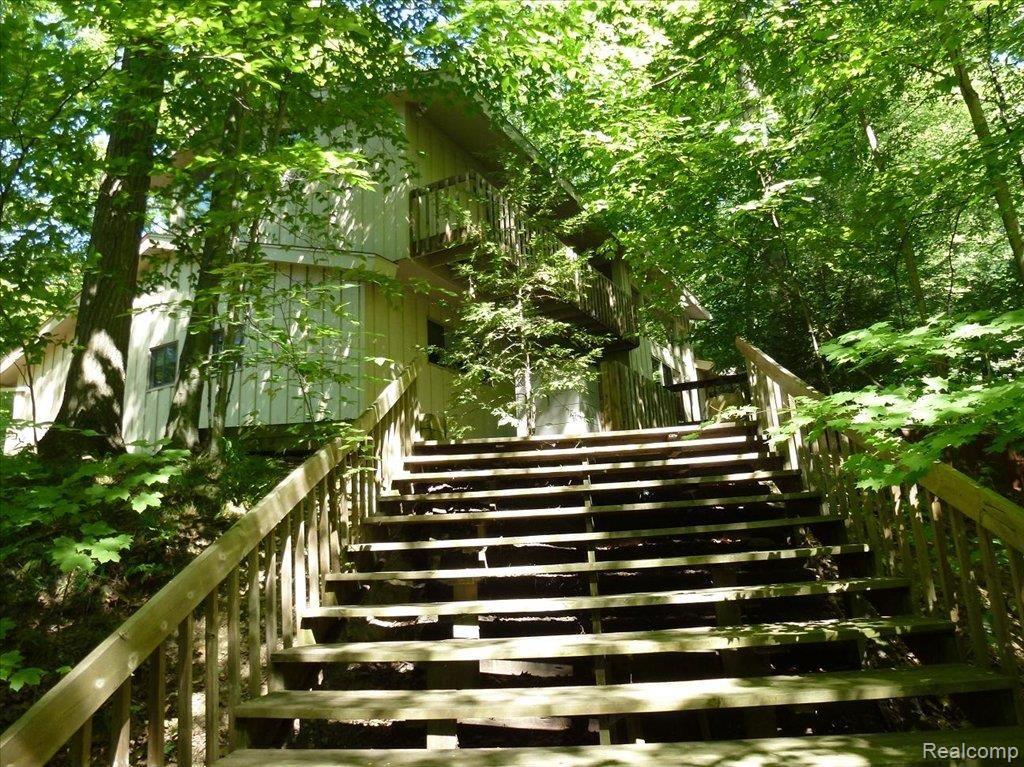 34055 Quaker Valley Road Farmington, MI 48331 - Photo 23 of 25 Stairs Up To Home From Stream