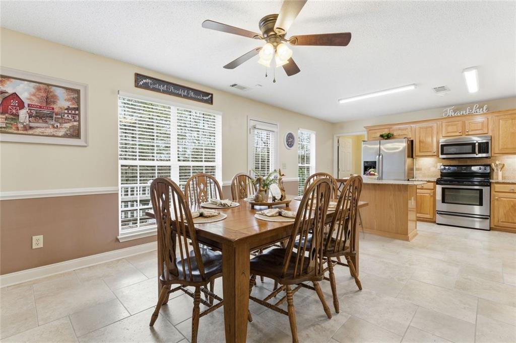 34 Rock Hole Path Dallas, GA 30132 - Photo 11 of 41 a view of a dining room with furniture