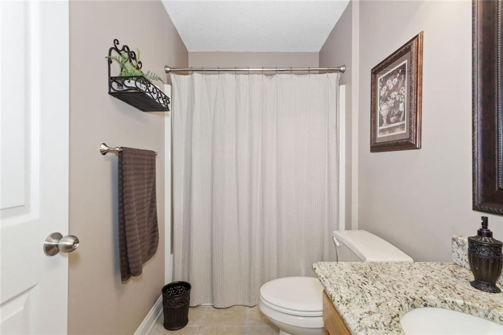 34 Rock Hole Path Dallas, GA 30132 - Photo 19 of 41 a bathroom with a toilet and a shower