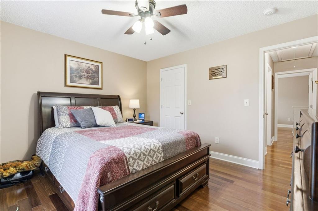 34 Rock Hole Path Dallas, GA 30132 - Photo 23 of 41 a bedroom with bed and wooden floor