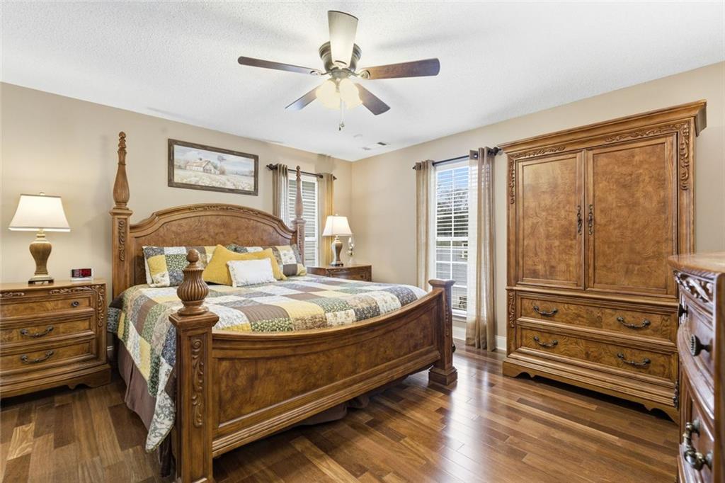 34 Rock Hole Path Dallas, GA 30132 - Photo 24 of 41 a bed room with a bed and a chandelier