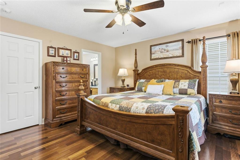 34 Rock Hole Path Dallas, GA 30132 - Photo 25 of 41 a bed room with a bed and a chandelier