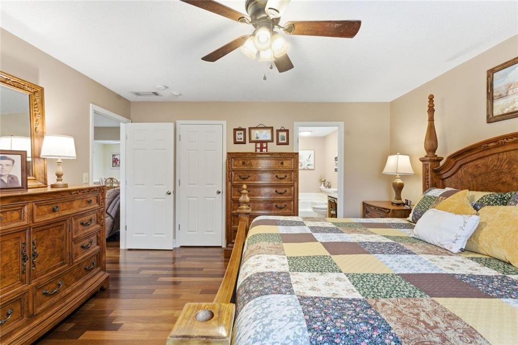 34 Rock Hole Path Dallas, GA 30132 - Photo 26 of 41 a bedroom with a bed and wooden floor