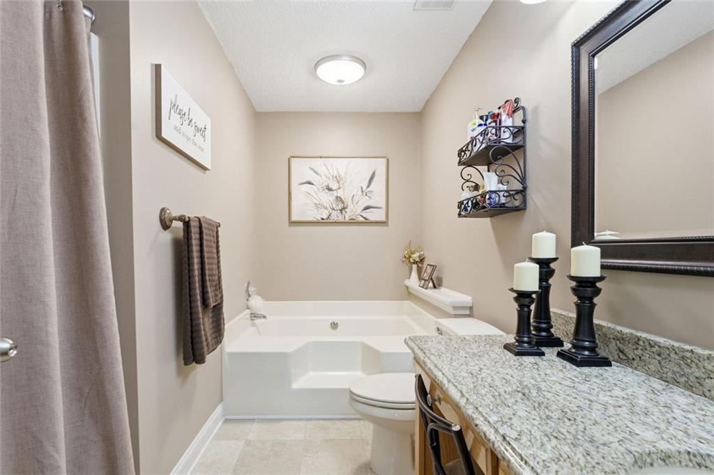 34 Rock Hole Path Dallas, GA 30132 - Photo 27 of 41 a living room with granite countertop furniture and a refrigerator