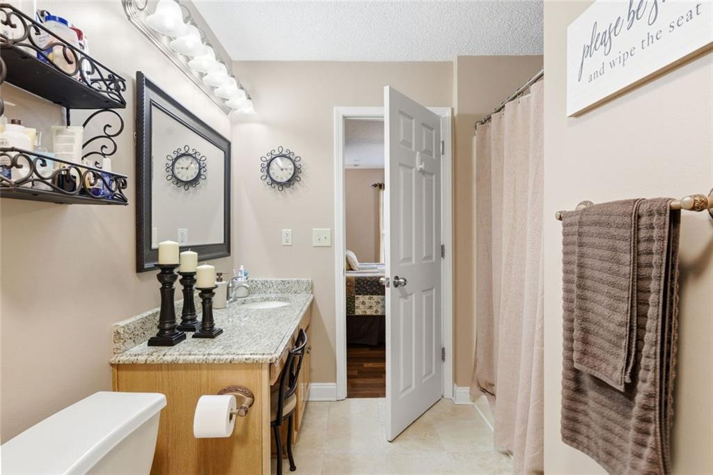 34 Rock Hole Path Dallas, GA 30132 - Photo 30 of 41 a bathroom with a sink and a mirror