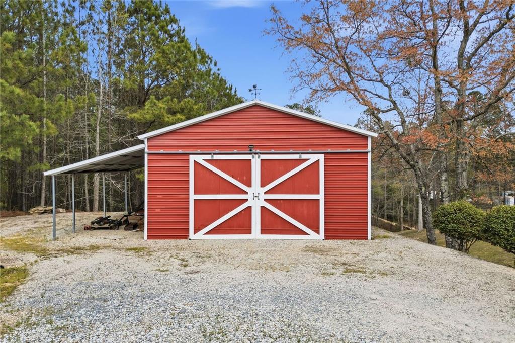 34 Rock Hole Path Dallas, GA 30132 - Photo 3 of 41 a front view of a house with a yard