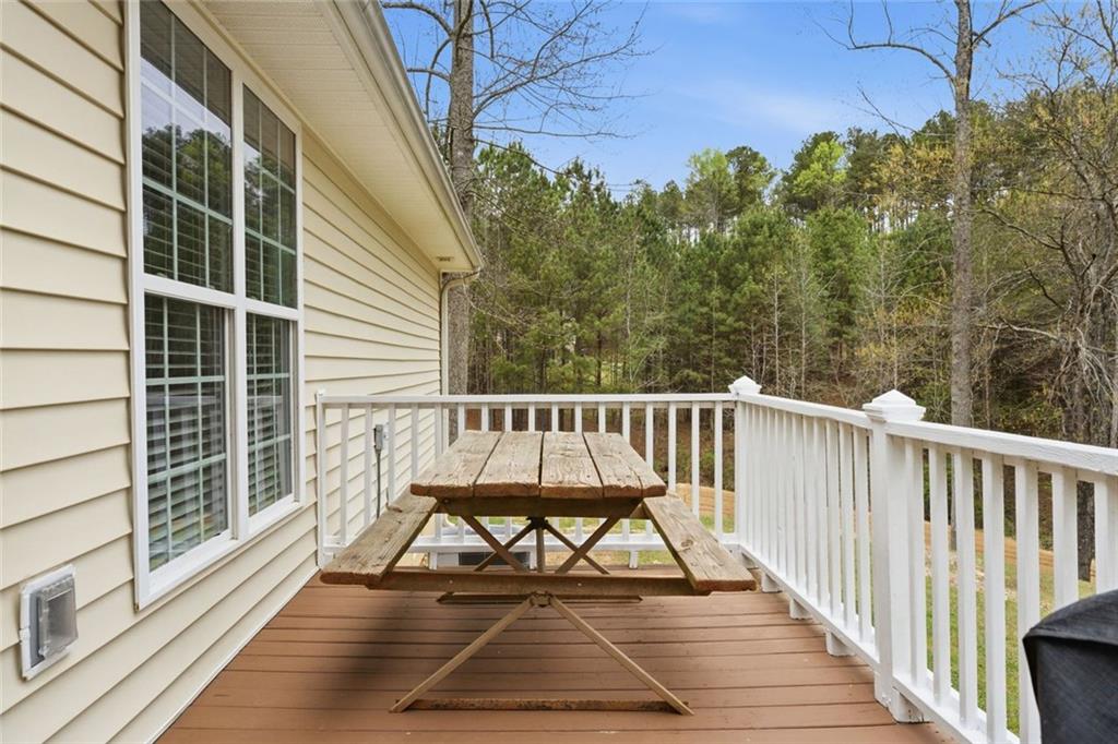 34 Rock Hole Path Dallas, GA 30132 - Photo 33 of 41 a view of balcony with wooden floor and bench