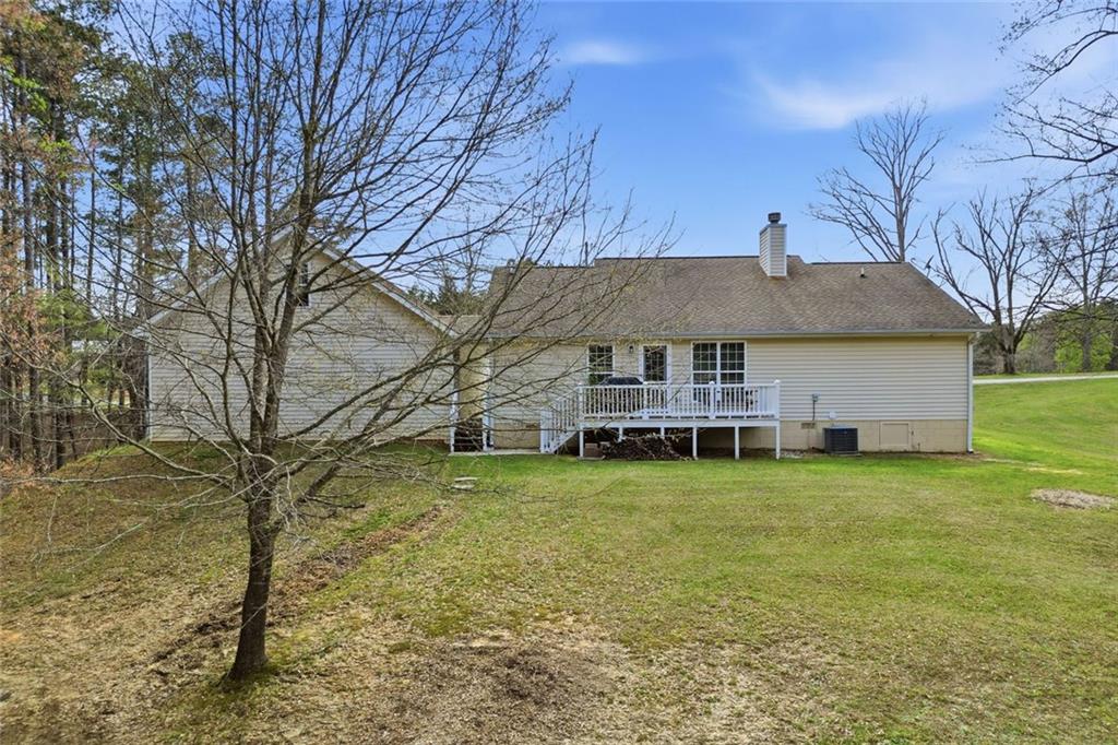 34 Rock Hole Path Dallas, GA 30132 - Photo 34 of 41 a front view of house with yard and trees in the background