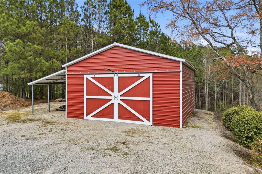 34 Rock Hole Path Dallas, GA 30132 - Photo 39 of 41 a front view of a house with a yard and garage