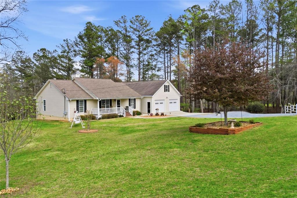 34 Rock Hole Path Dallas, GA 30132 - Photo 41 of 41 a front view of a house with a yard
