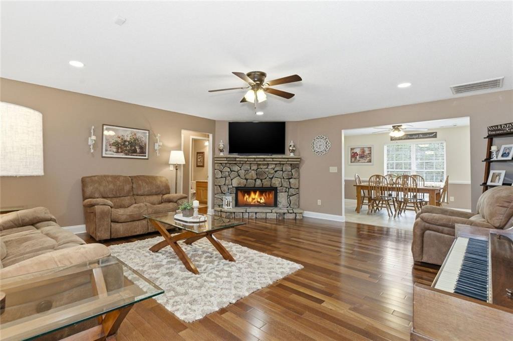 34 Rock Hole Path Dallas, GA 30132 - Photo 7 of 41 a living room with furniture a fireplace and a flat screen tv