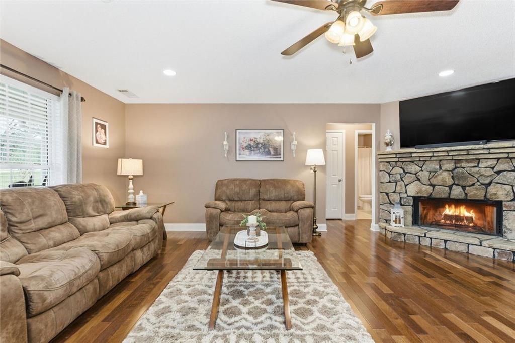 34 Rock Hole Path Dallas, GA 30132 - Photo 8 of 41 a living room with furniture and a flat screen tv