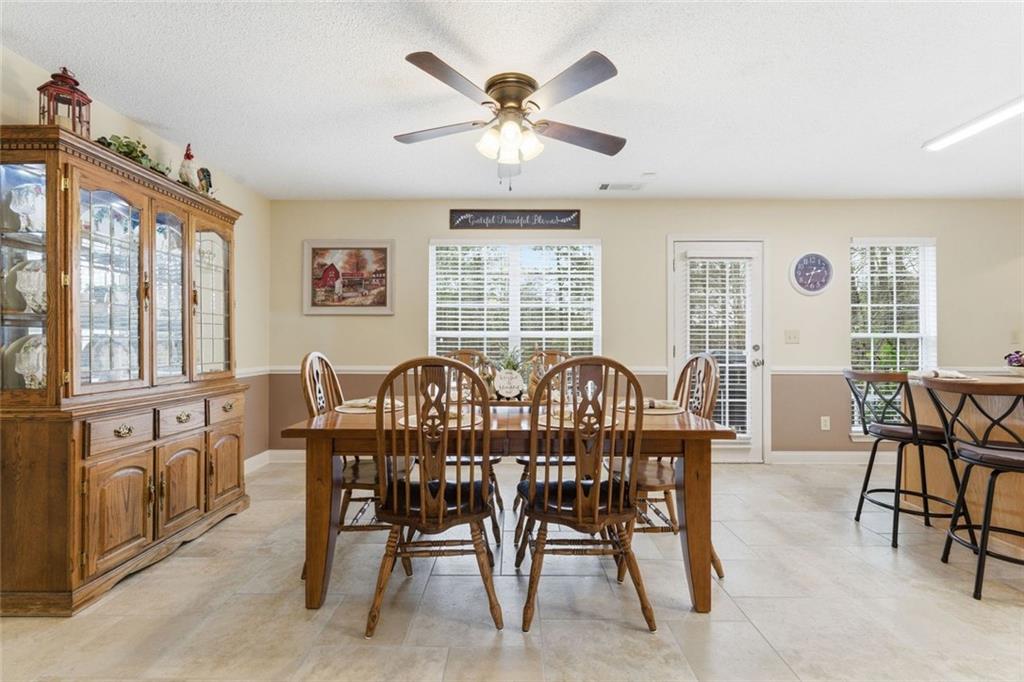 34 Rock Hole Path Dallas, GA 30132 - Photo 10 of 41 a view of a dining room with furniture window and outside view