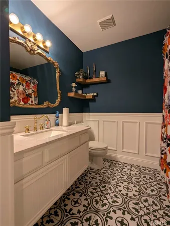 a bathroom with a sink and a shower curtain