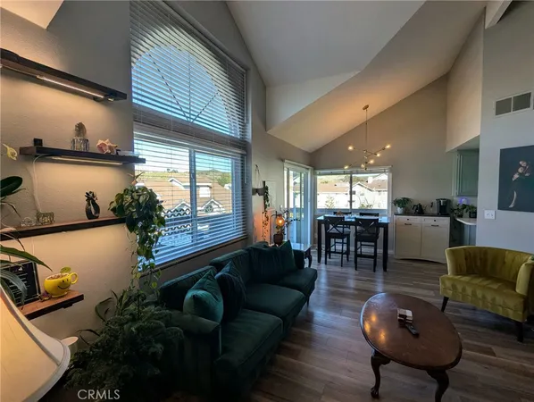 a living room with furniture fireplace and flat screen tv