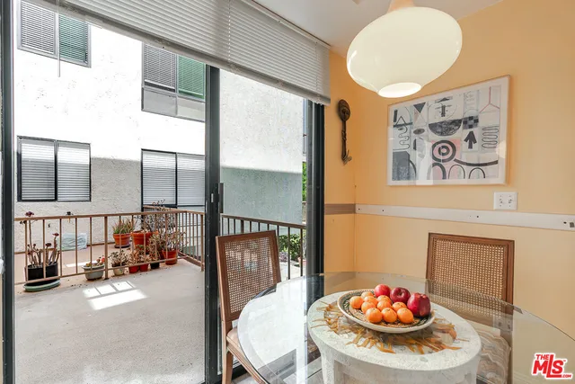 a outdoor living space with furniture and a potted plant