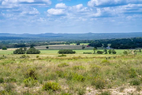 a view of an ocean beach and mountain