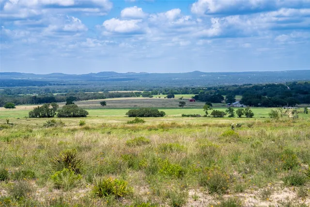 a view of an ocean beach and mountain