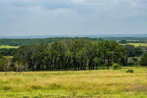 a view of a swimming pool with an outdoor space and seating area