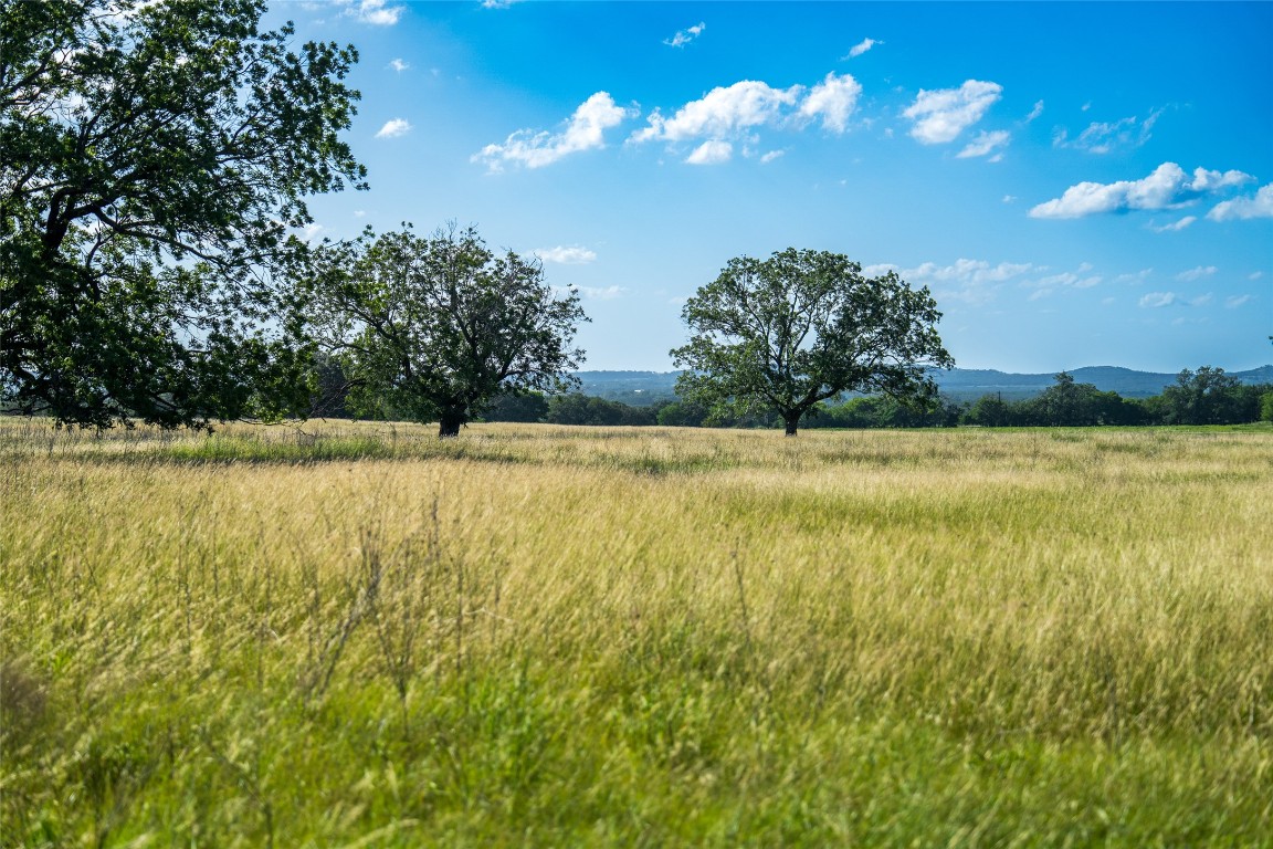 302 Hye-Albert Road Hye, TX 78635 - Photo 31 of 34 a view of a swimming pool with an outdoor space and seating area