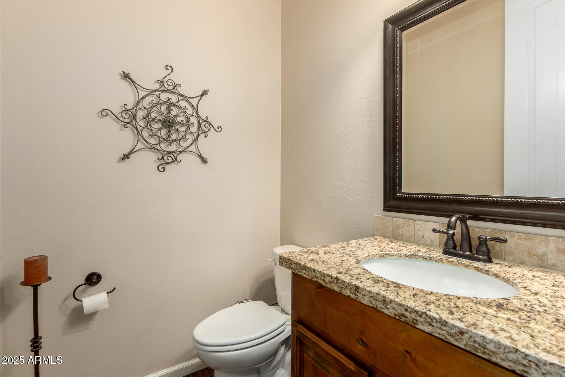3614 West Phillips Road San Tan Valley, AZ 85144 - Photo 16 of 67 a bathroom with a granite countertop sink toilet and mirror