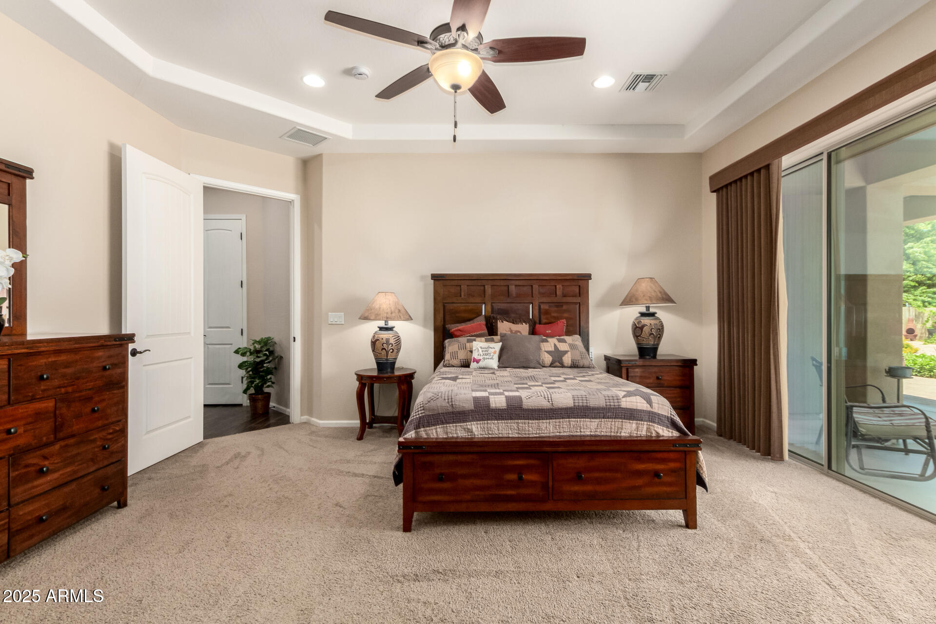 3614 West Phillips Road San Tan Valley, AZ 85144 - Photo 17 of 67 a bedroom with a bed and ceiling fan