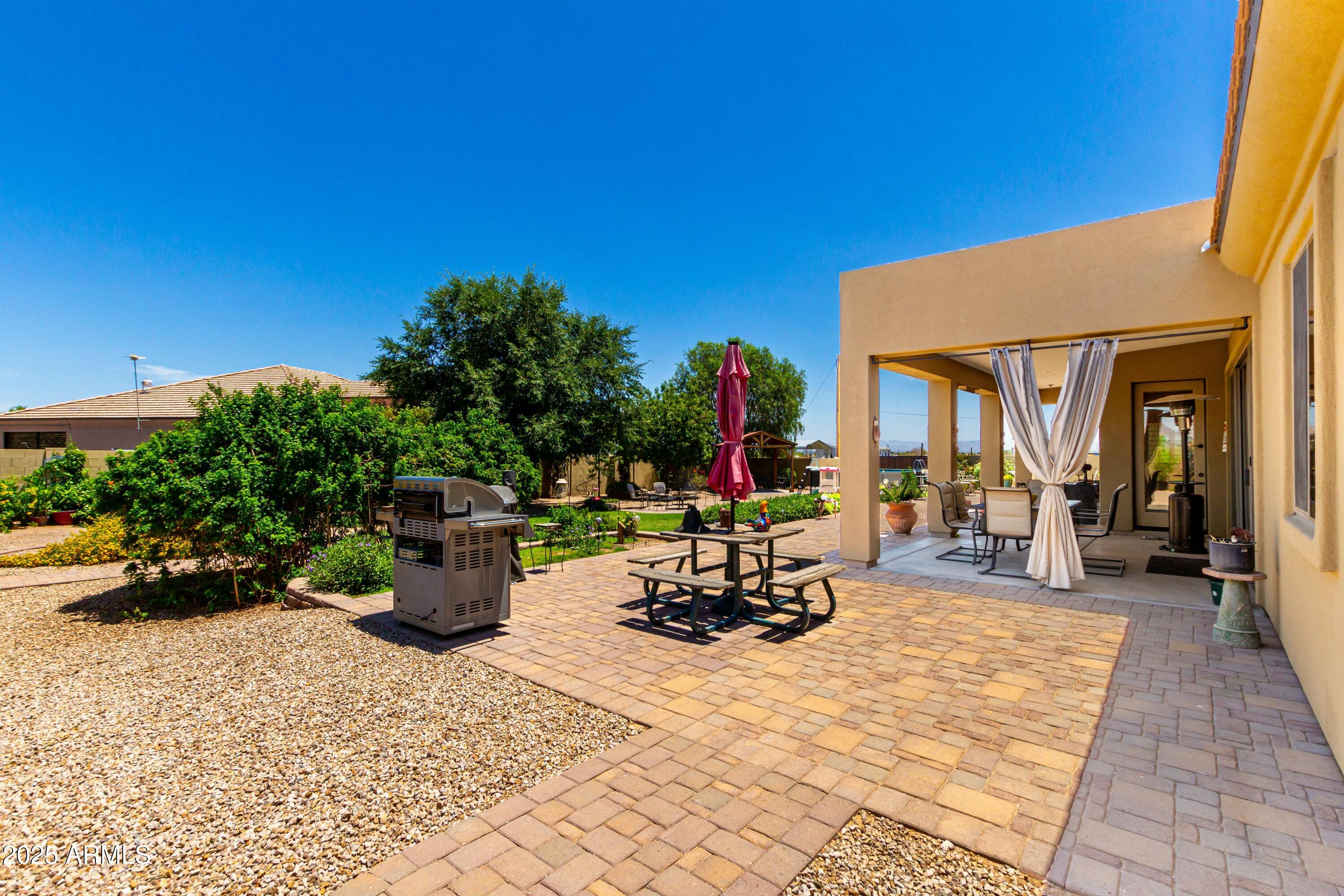 3614 West Phillips Road San Tan Valley, AZ 85144 - Photo 39 of 67 a view of a patio with couches and potted plants