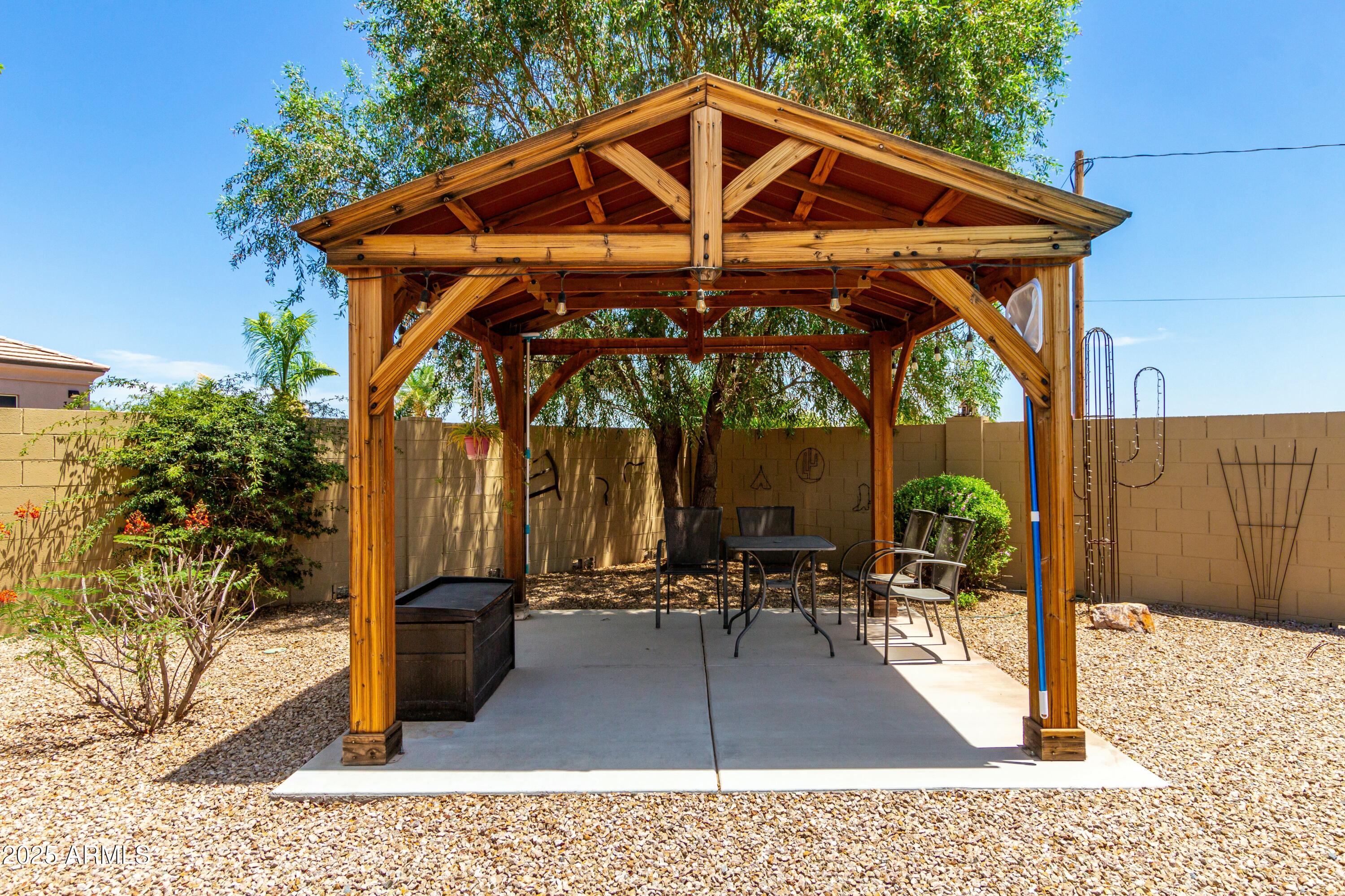 3614 West Phillips Road San Tan Valley, AZ 85144 - Photo 46 of 67 a patio with table and chairs