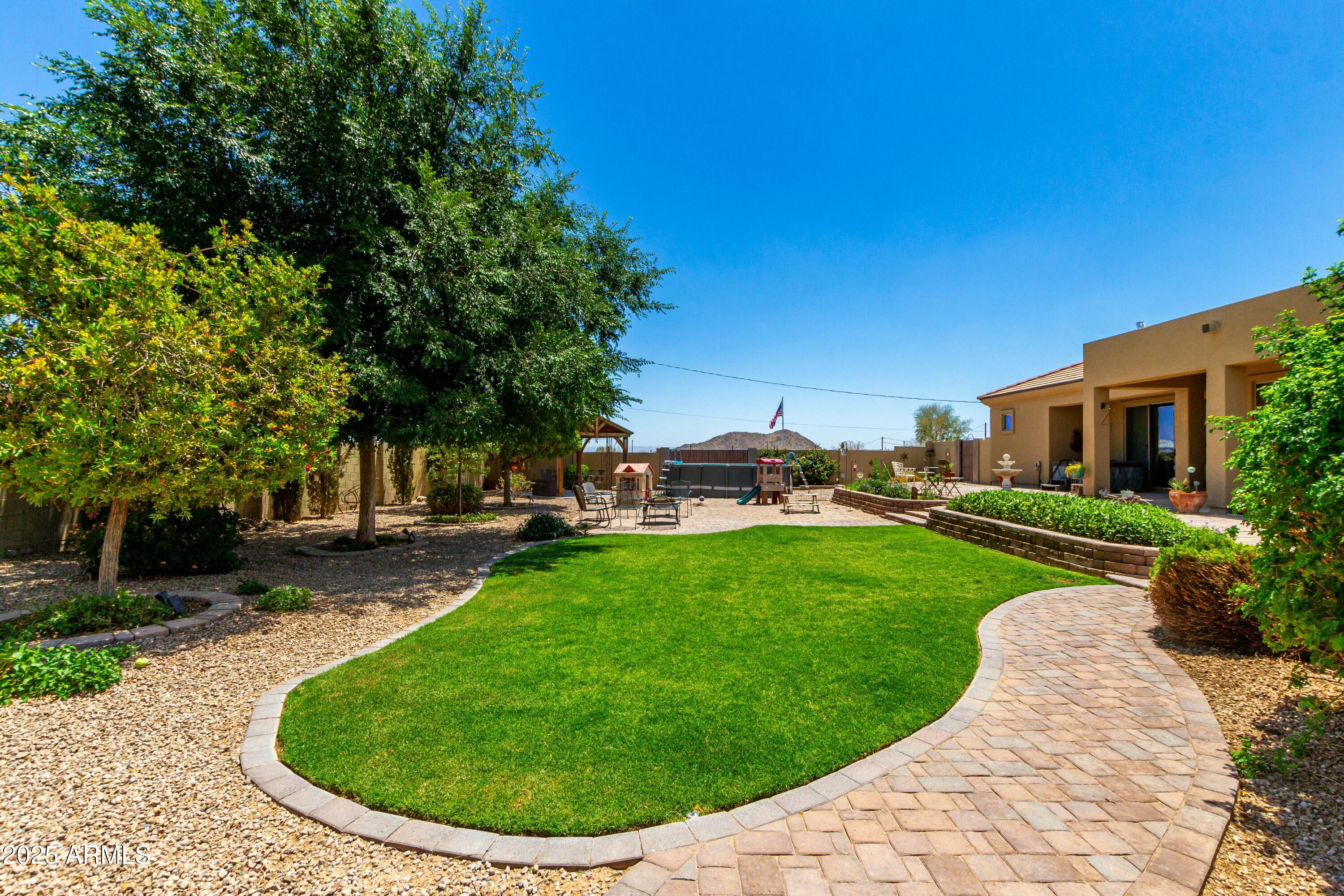 3614 West Phillips Road San Tan Valley, AZ 85144 - Photo 51 of 67 a view of a backyard with sitting area