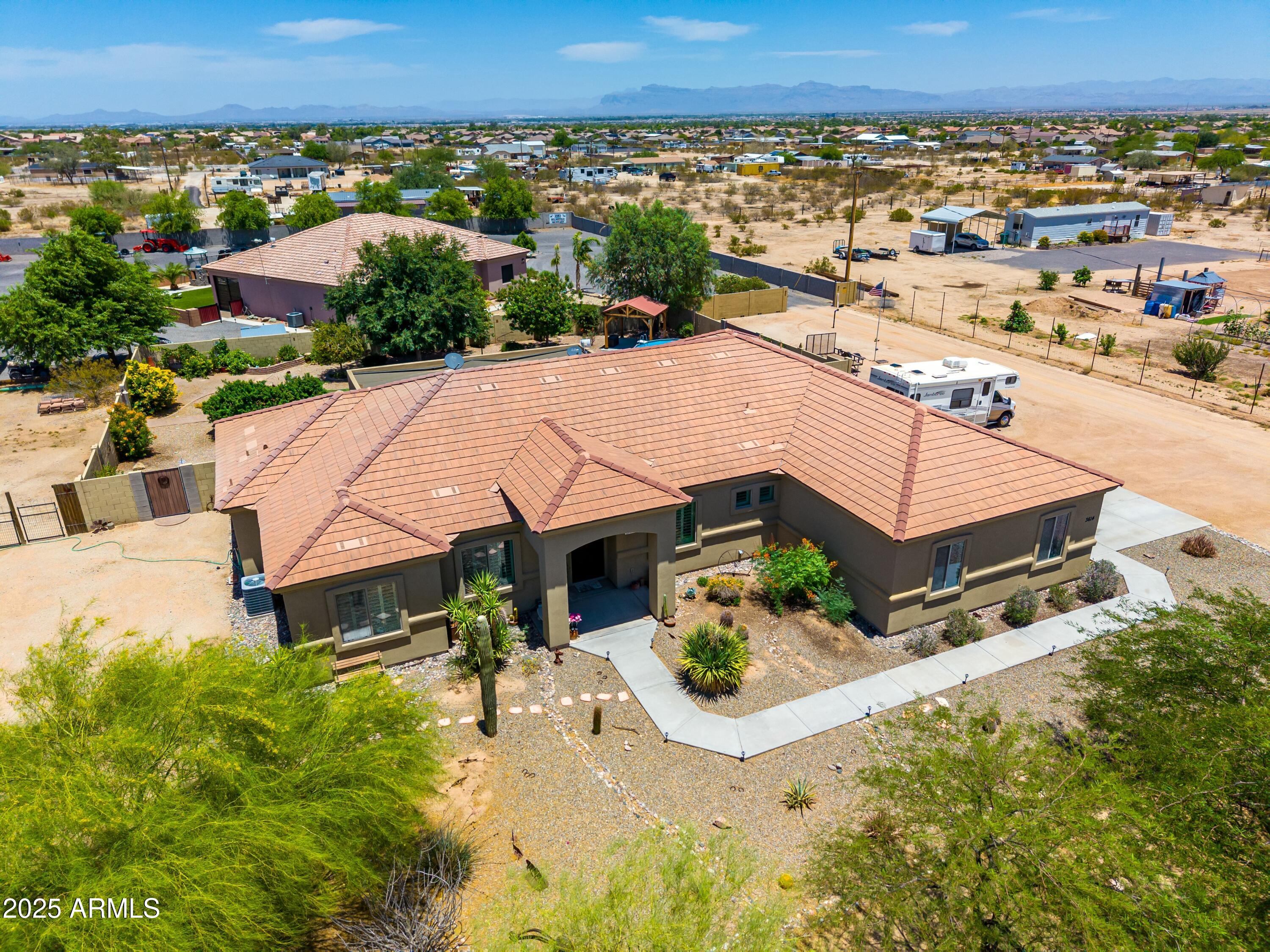 3614 West Phillips Road San Tan Valley, AZ 85144 - Photo 63 of 67 an aerial view of a house with a yard